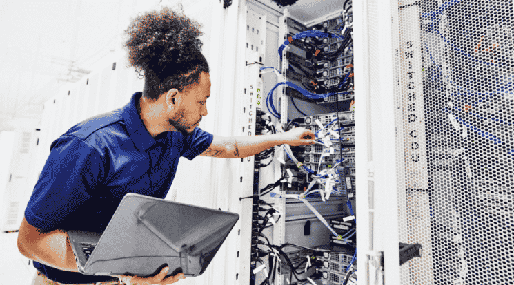 man in data centre